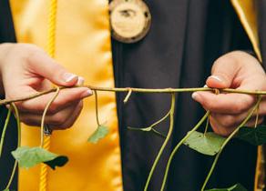 grad holding ivy